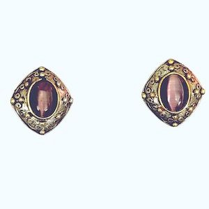 MK Signed Earrings. Silvertone w Goldtone metal surrounds purple oval stones